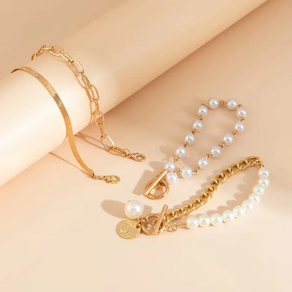 Chic Gold 4-Piece Bracelet Set – Snake, Pearls & Links | Golden